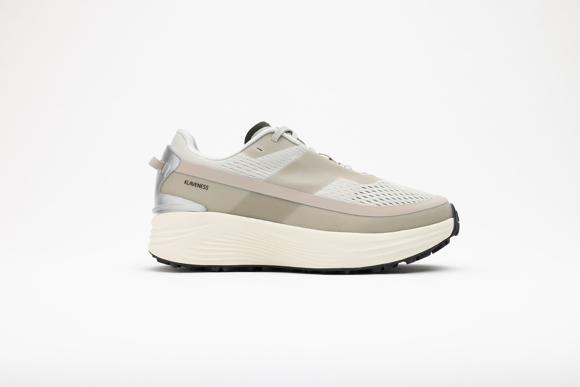 Beige PSGEN3 sneaker in profile, on a cream midsole.