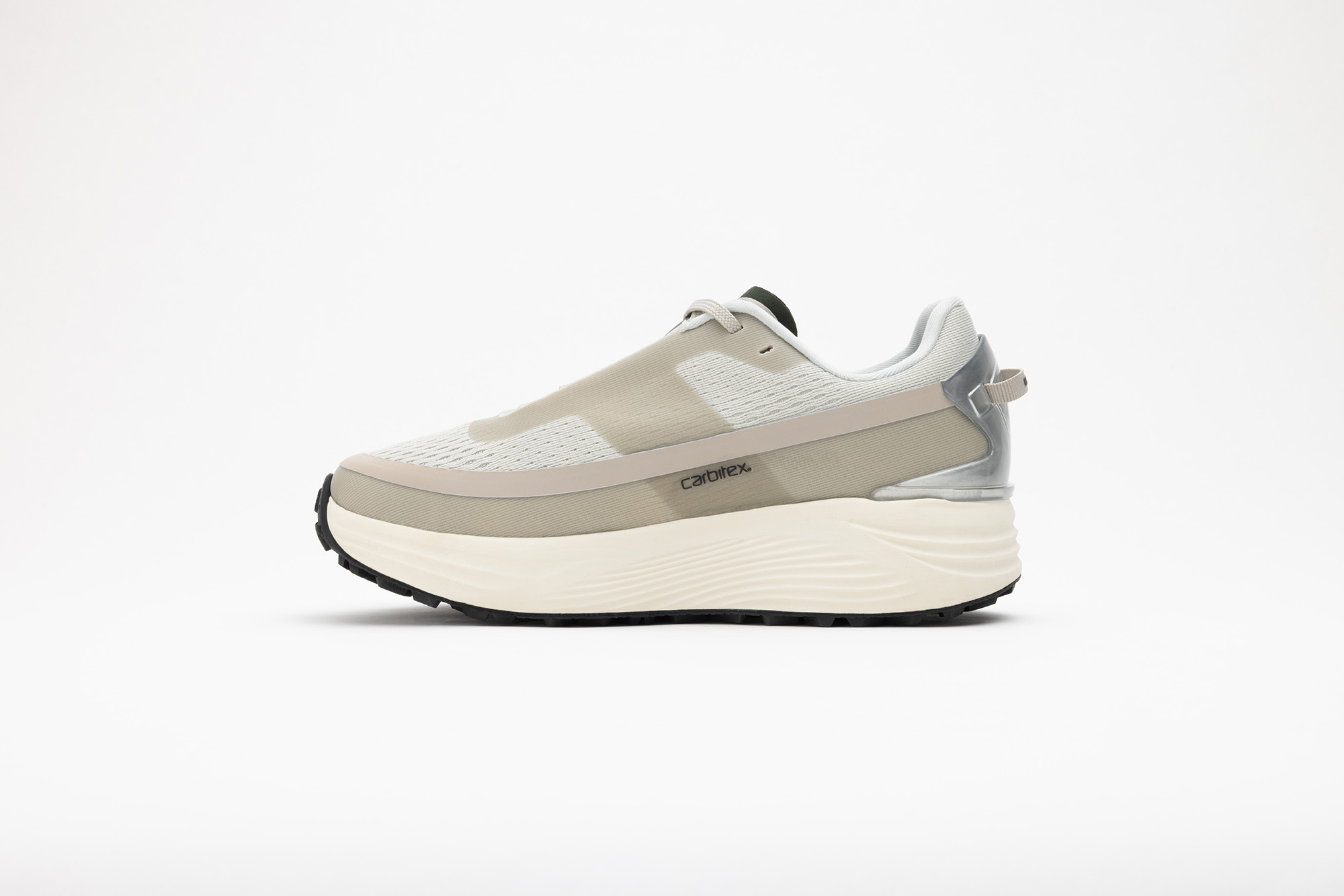 Beige PSGEN3 sneaker from its inner side, showing the Carbitex badge.
