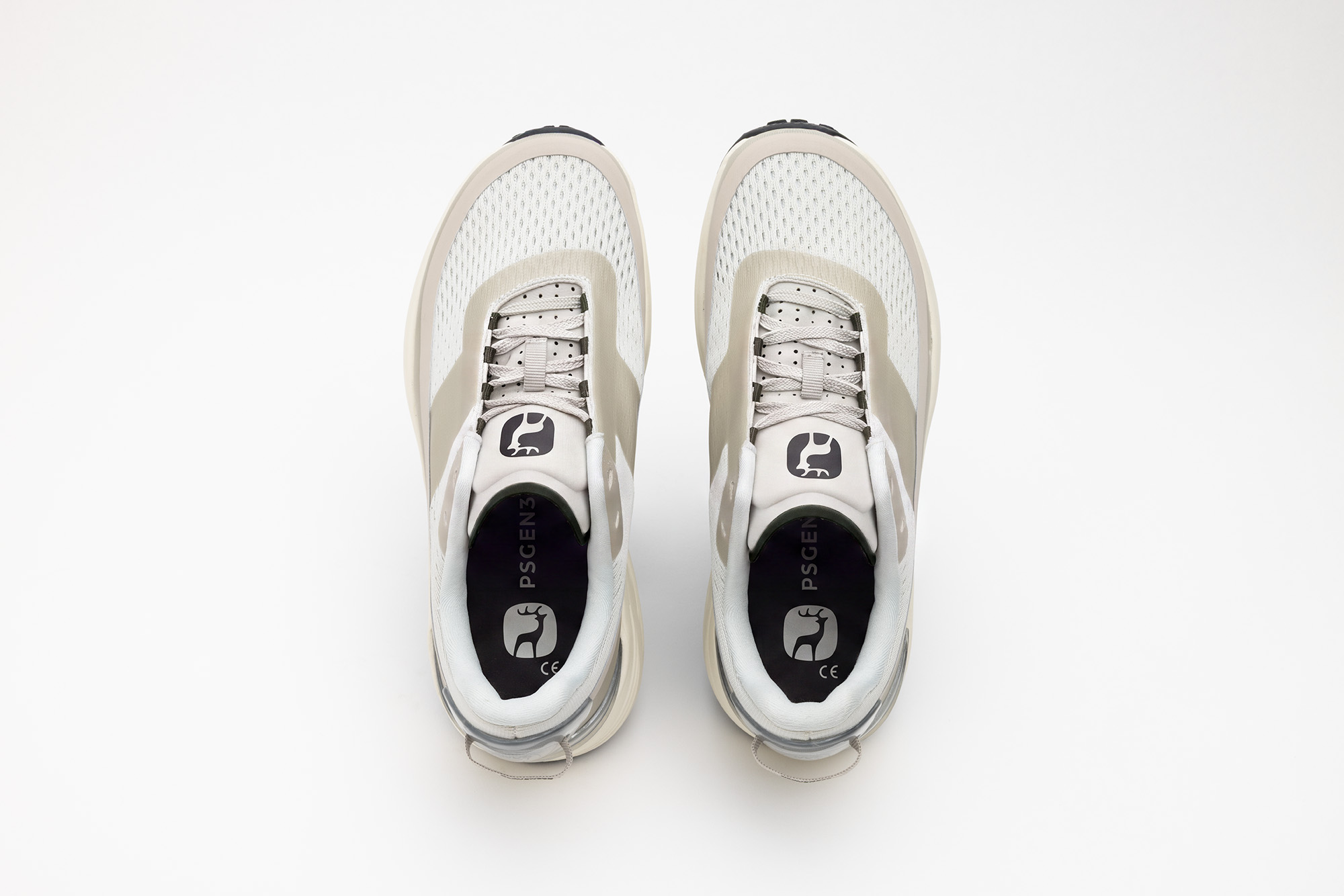 A pair of beige PSGEN3 sneakers seen from directly above.