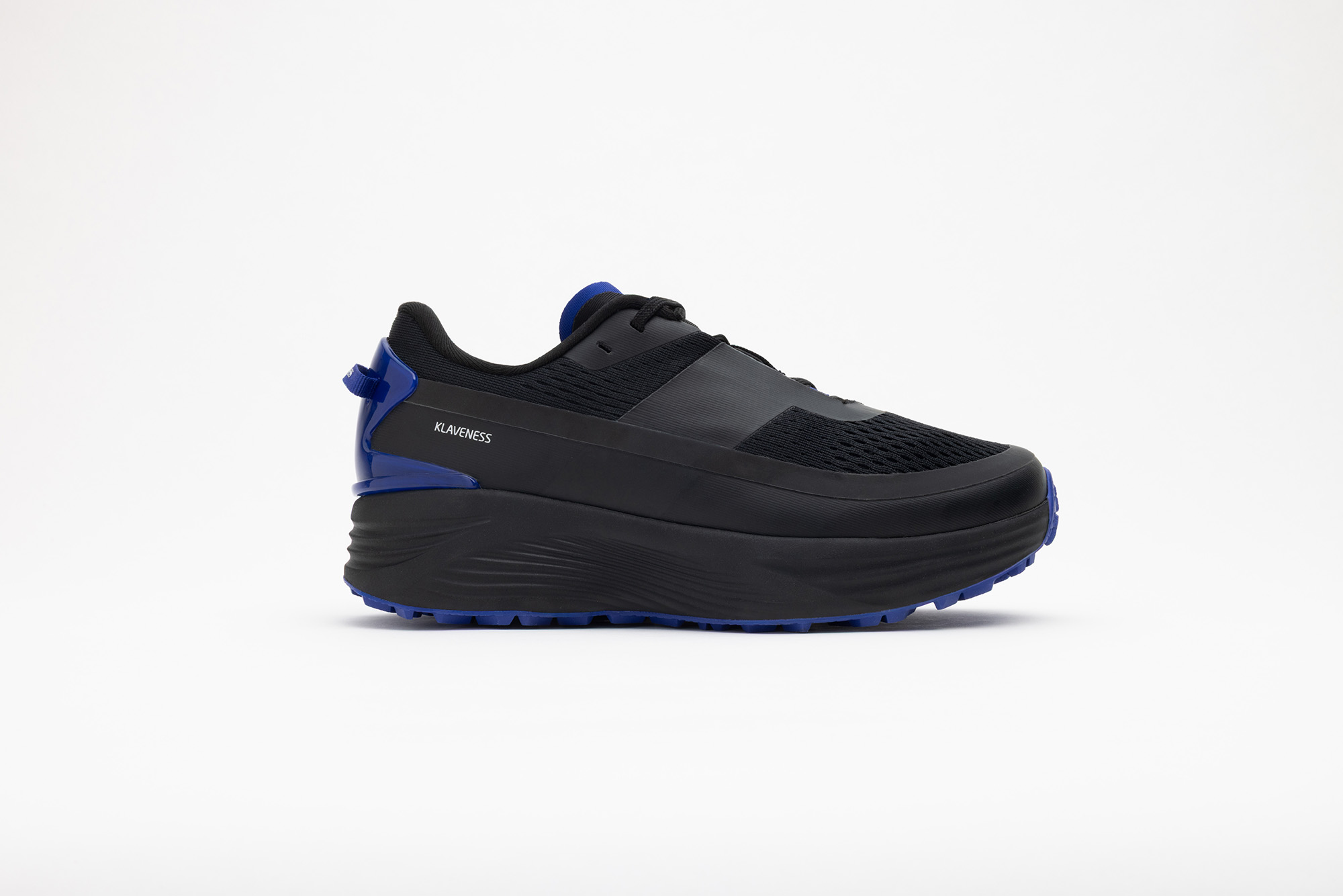 Black PSGEN3 sneaker in profile, with cobalt blue trim.