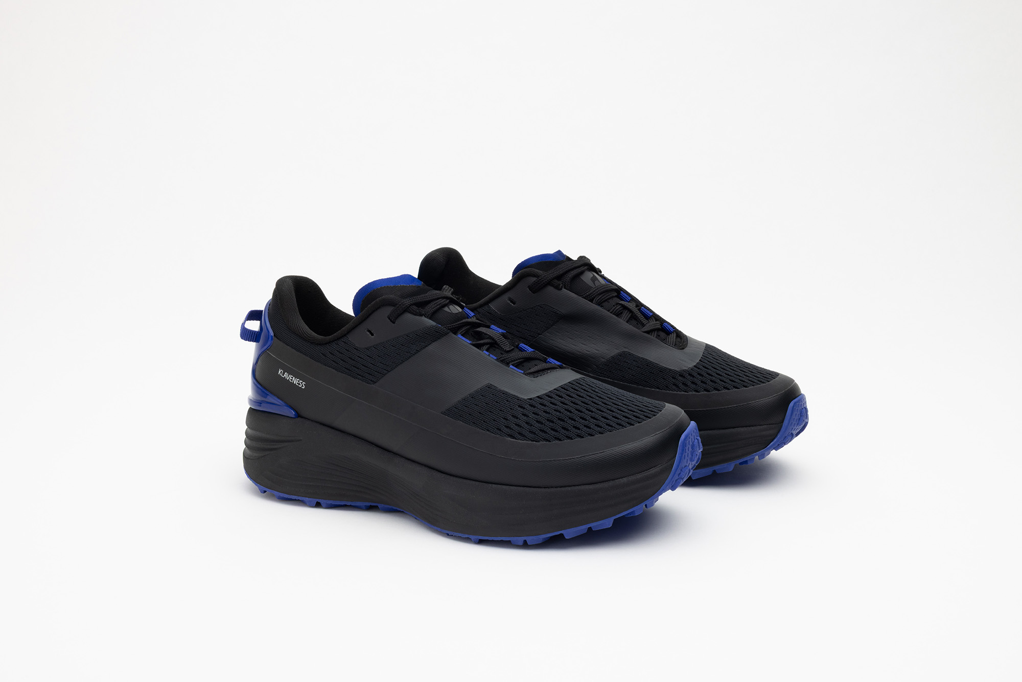 A pair of black PSGEN3 sneakers from the front at an angle.