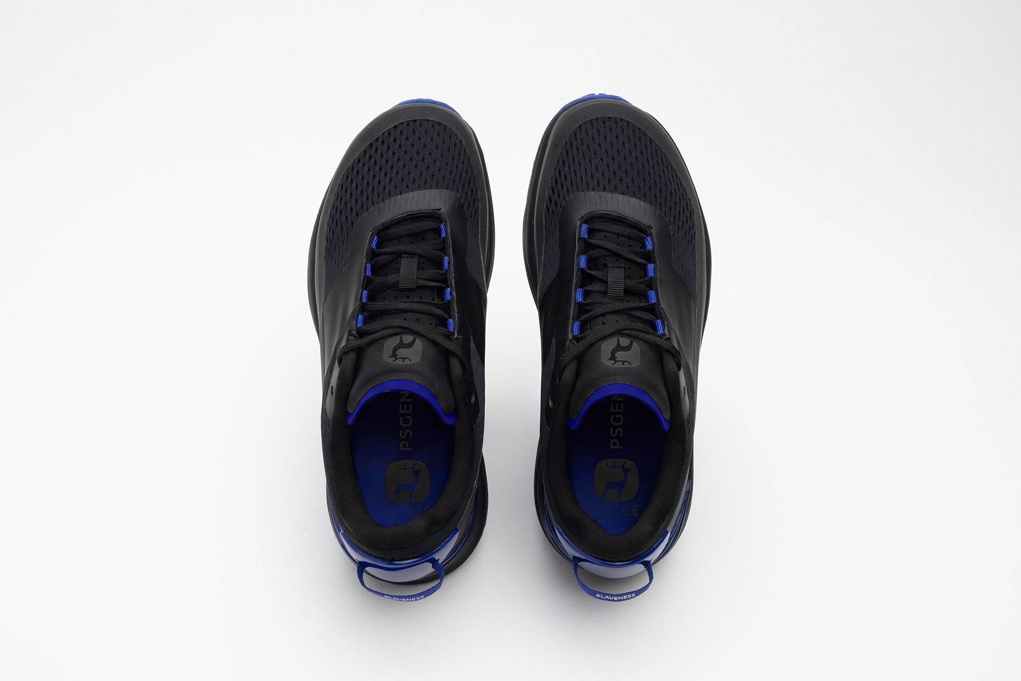 A pair of black PSGEN3 sneakers seen from directly above.