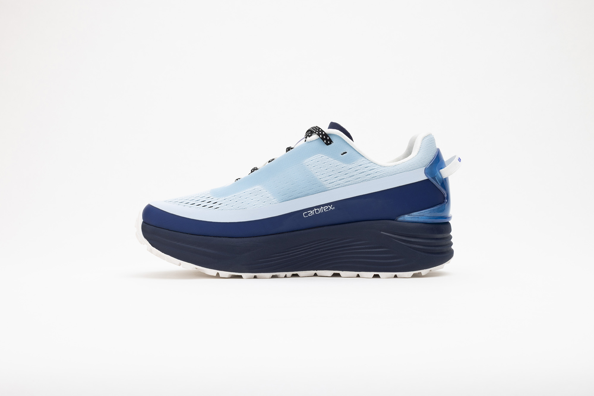 Pale blue PSGEN3 sneaker from its inner side, showing the Carbitex badge.