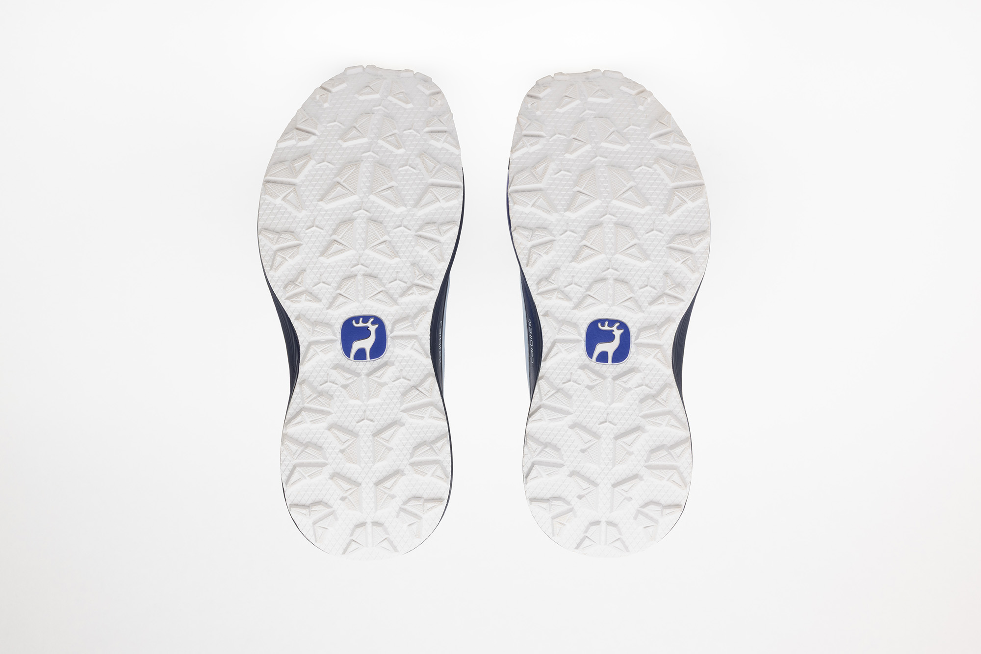 The white outsoles of the pale blue PSGEN3 sneakers.